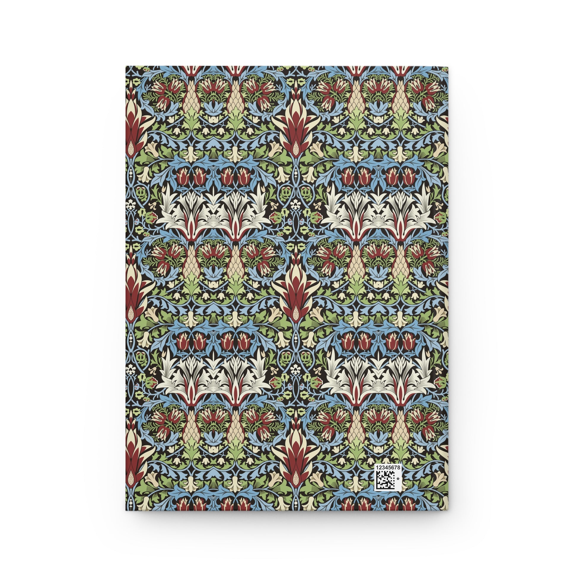 A hardcover notebook featuring a dense, symmetrical William Morris-style floral pattern in blue, green, cream, and rust red, with a small white publisher logo in the bottom right corner.