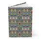 A hardcover notebook featuring a detailed, symmetrical Victorian-style floral pattern in blue, green, red, and cream, shown standing upright on a white background.