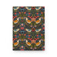 Notebook with a colorful floral and bird pattern on a white background