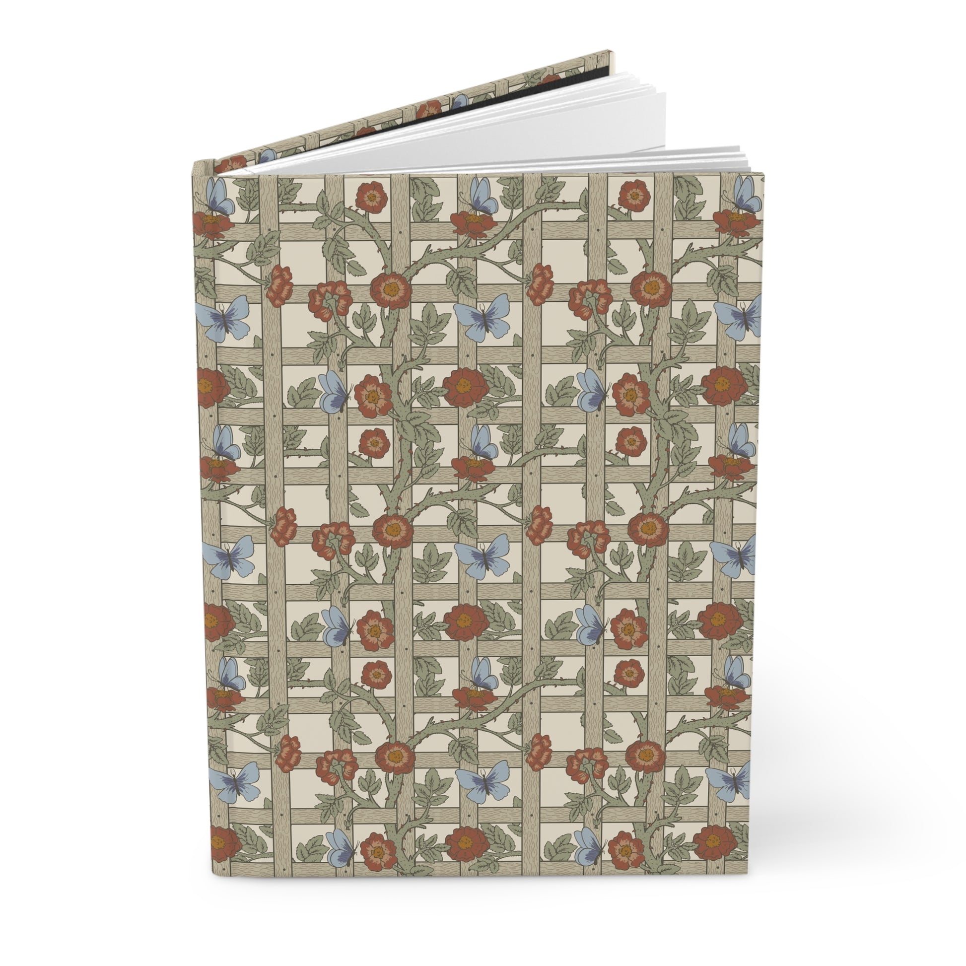 Notebook with William Morris & Co floral and butterfly pattern on a white background