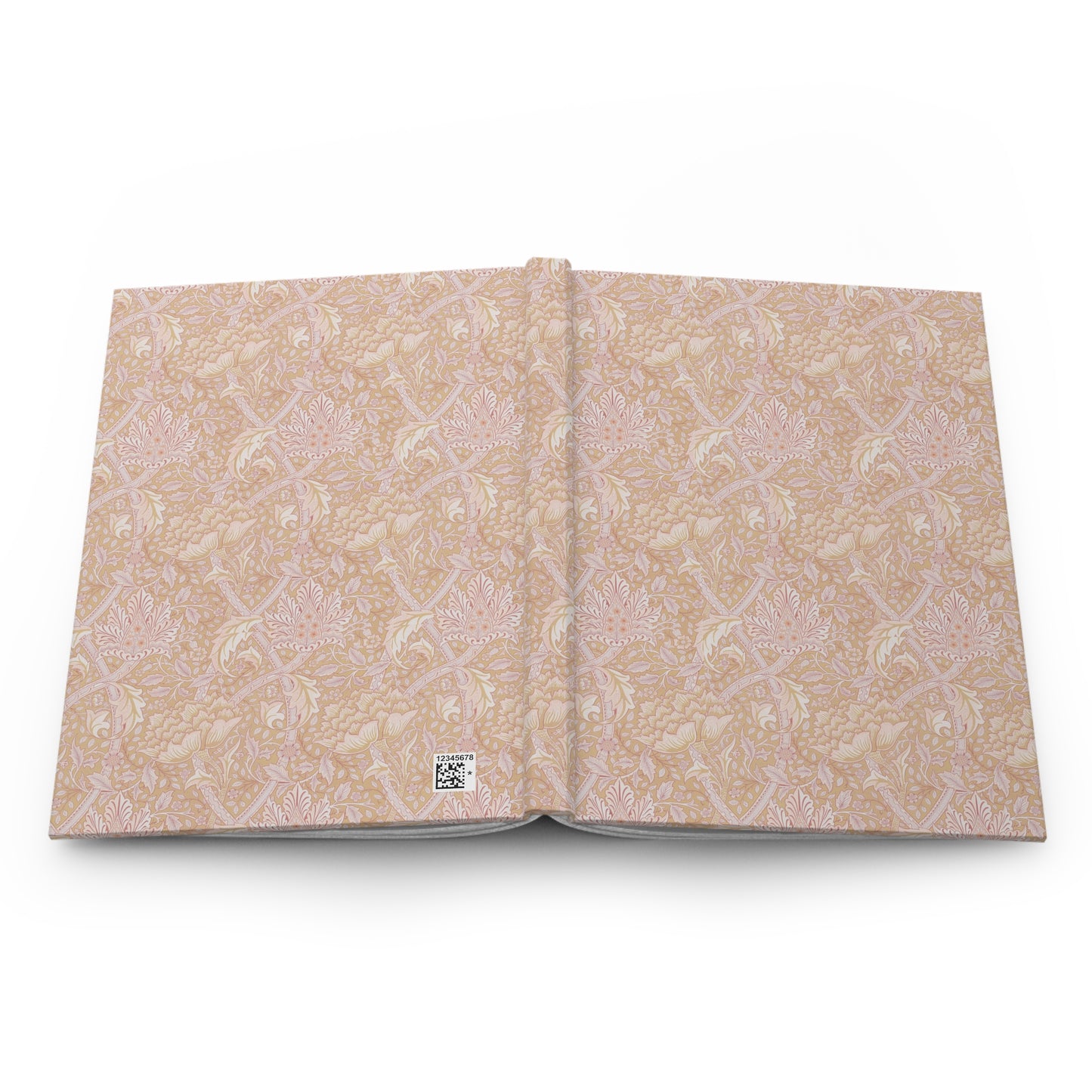 Open book with beige floral pattern on a white background