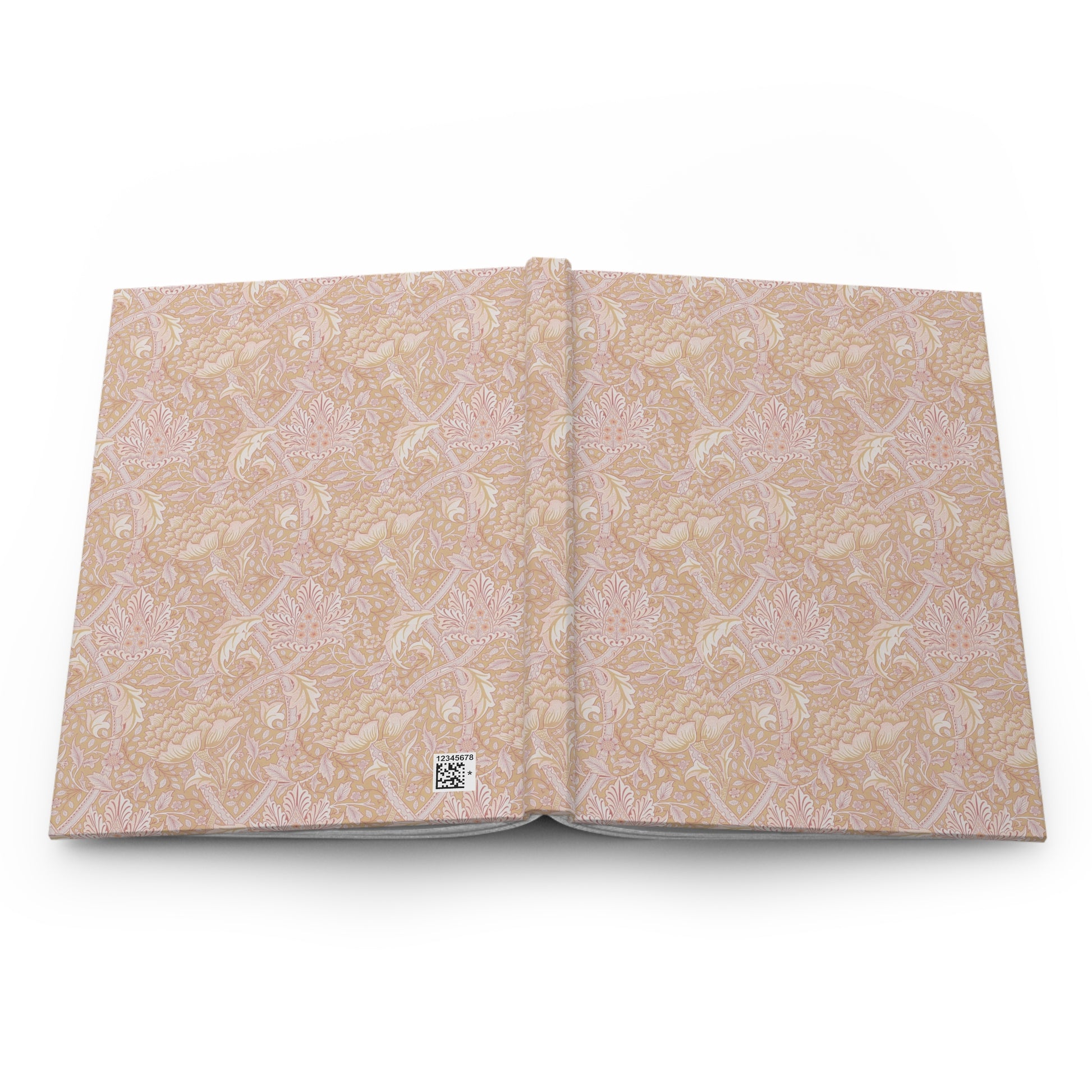 Open book with beige floral pattern on a white background
