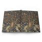 Book with a decorative cover featuring trees and animals on a white background