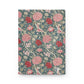 Floral patterned notebook with pink and red flowers on a blue background