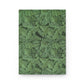 Green leafy patterned notebook on a white background