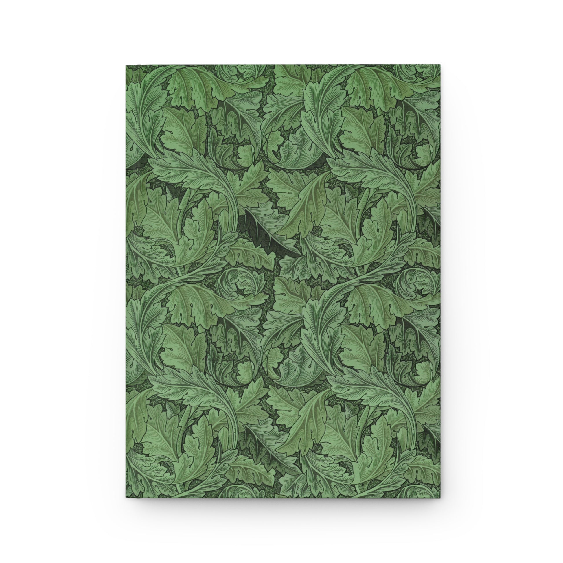 Green leafy patterned notebook on a white background