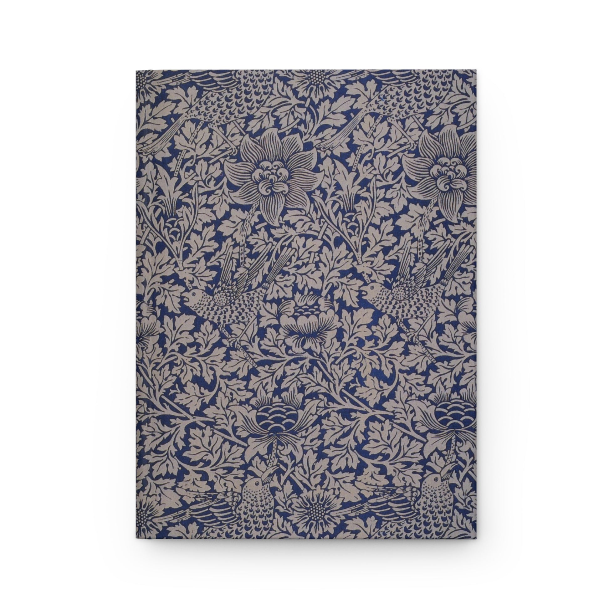 Floral patterned notebook with blue and beige design on a white background