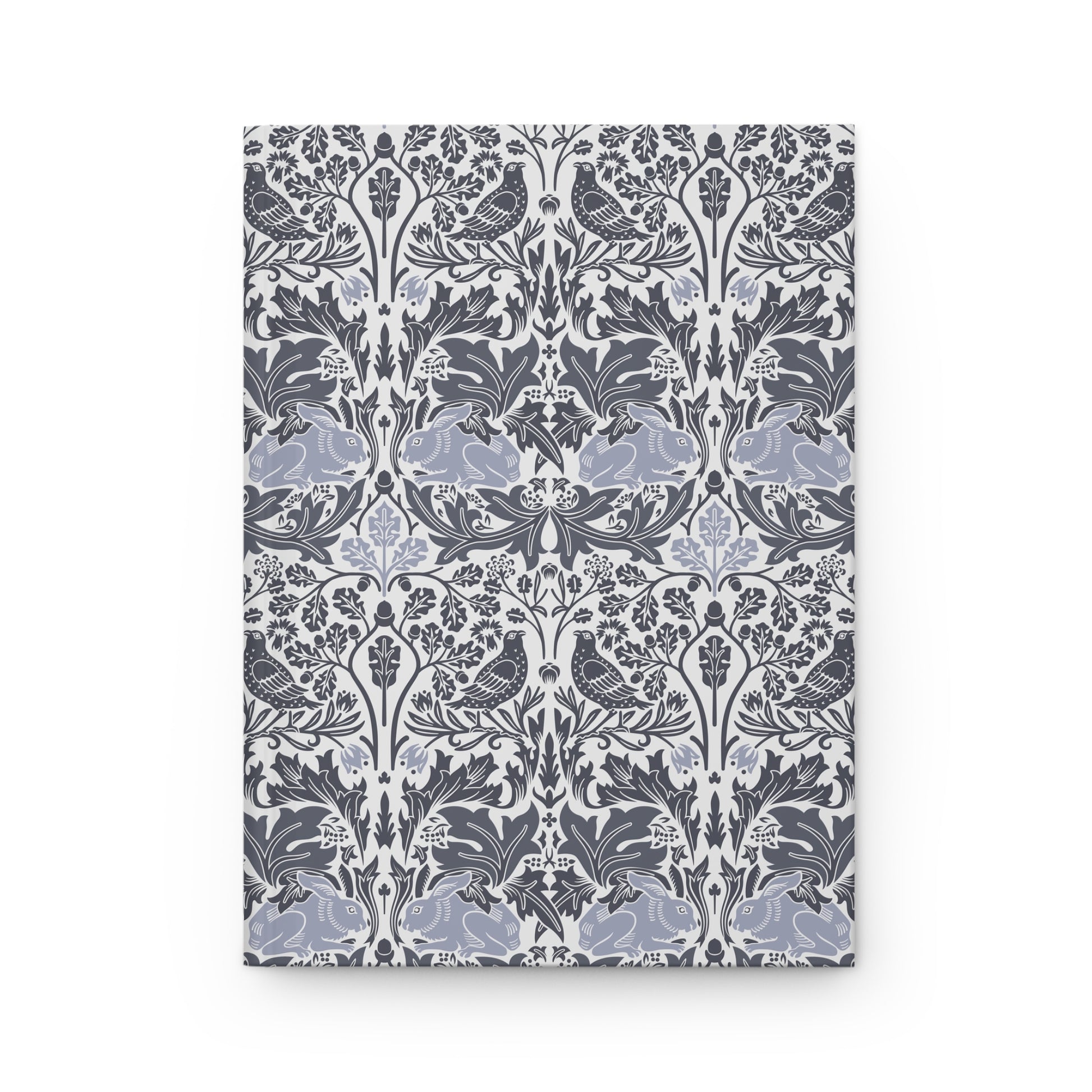 Notebook with a floral and bird pattern on a white background
