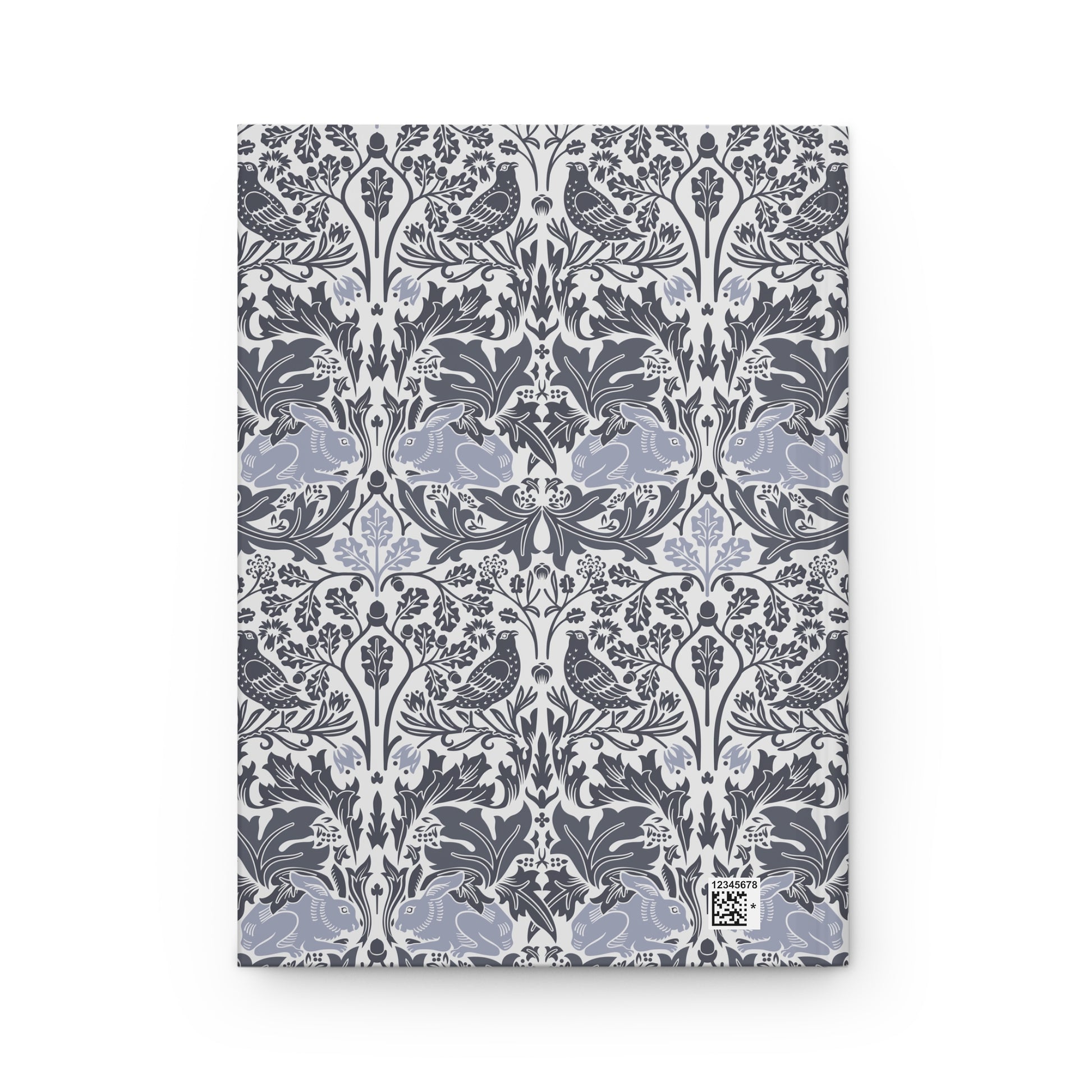 Notebook with a floral and bird pattern on a white background