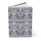 Notebook with a floral and bird pattern on a white background