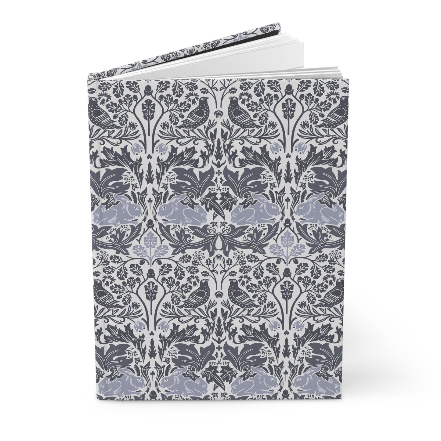 Notebook with a floral and bird pattern on a white background
