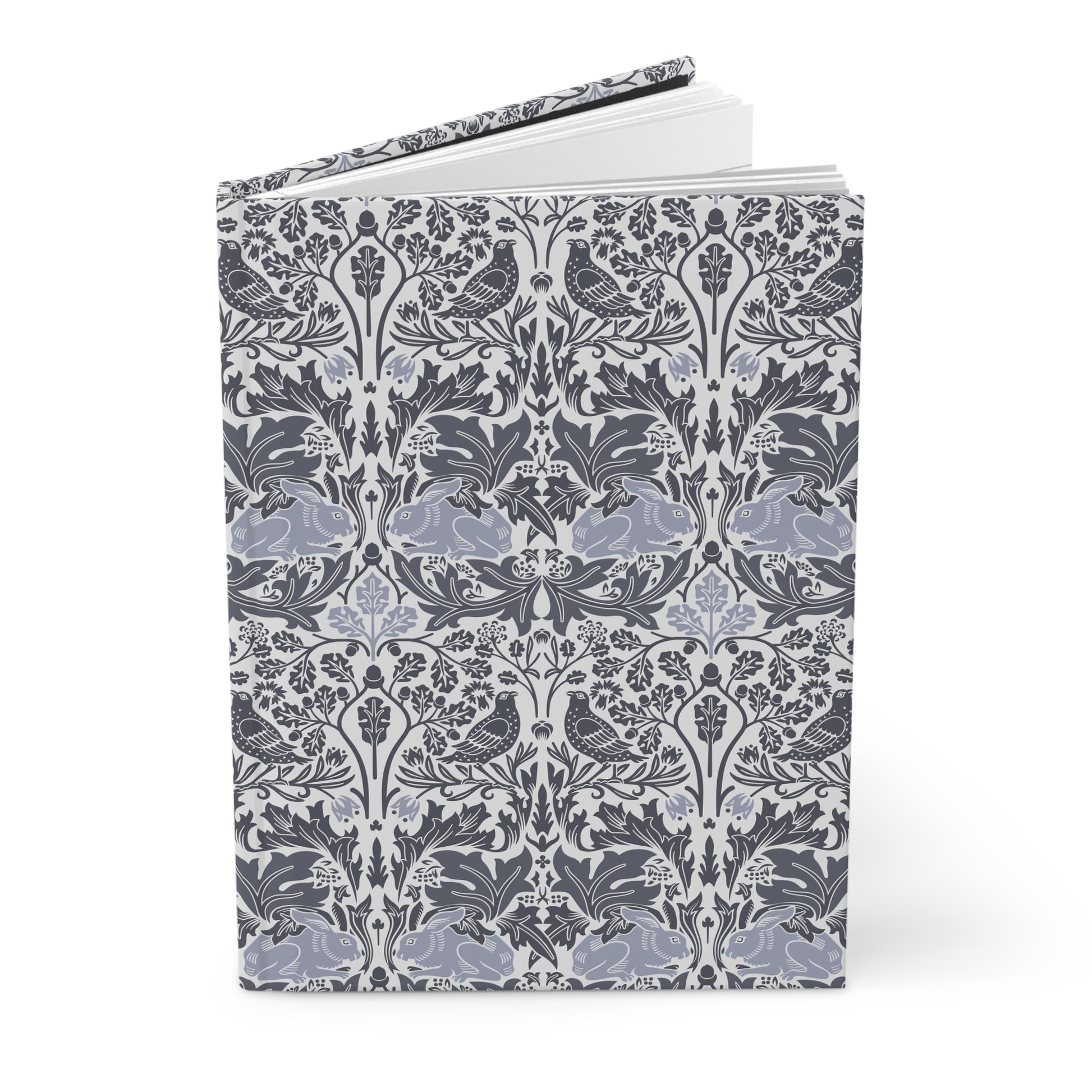 Notebook with a floral and bird pattern on a white background
