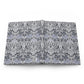 Flat notebook with a William Morris & Co floral pattern on a white background