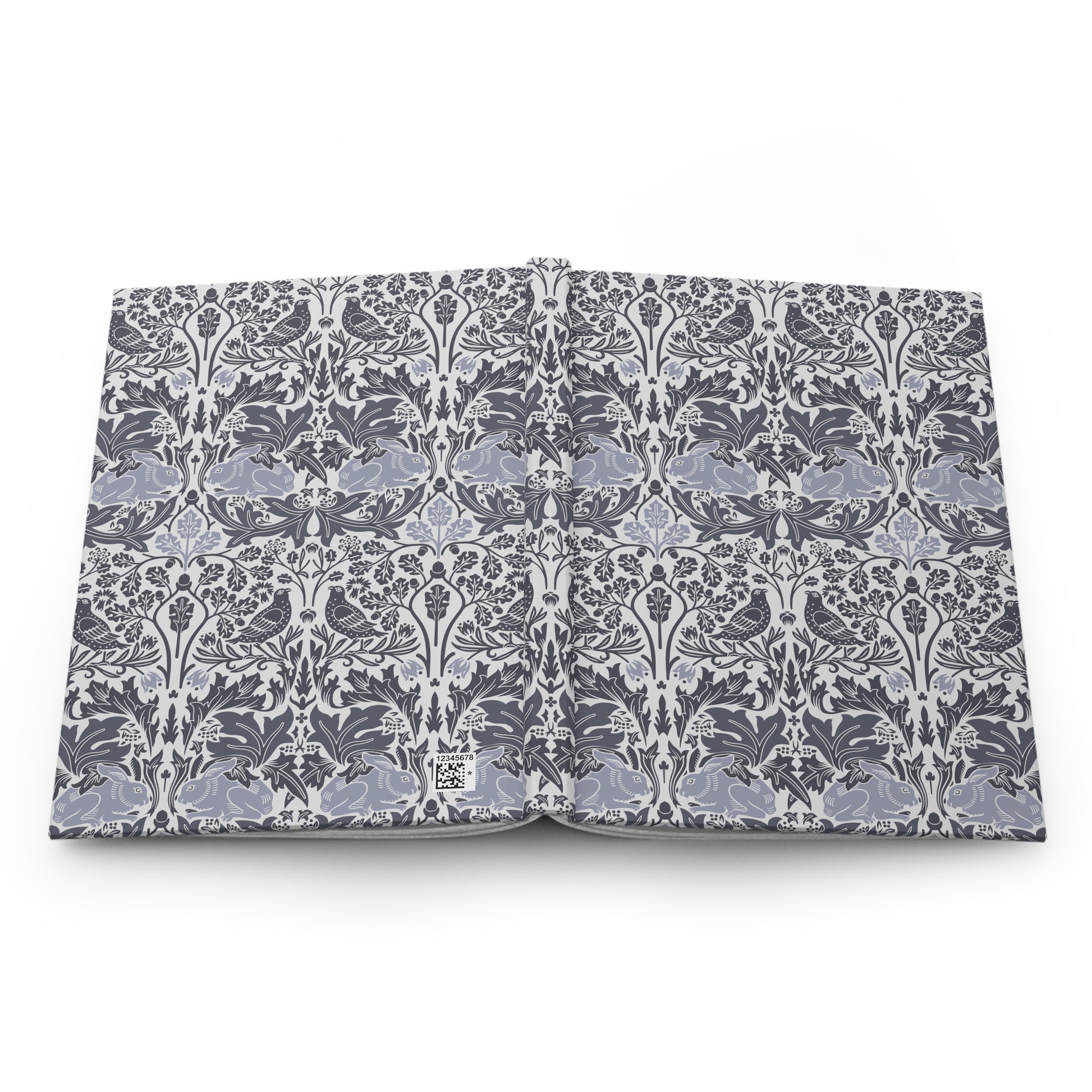 Flat notebook with a William Morris & Co floral pattern on a white background
