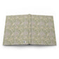 Open book with a green William Morris & Co floral pattern on a white background