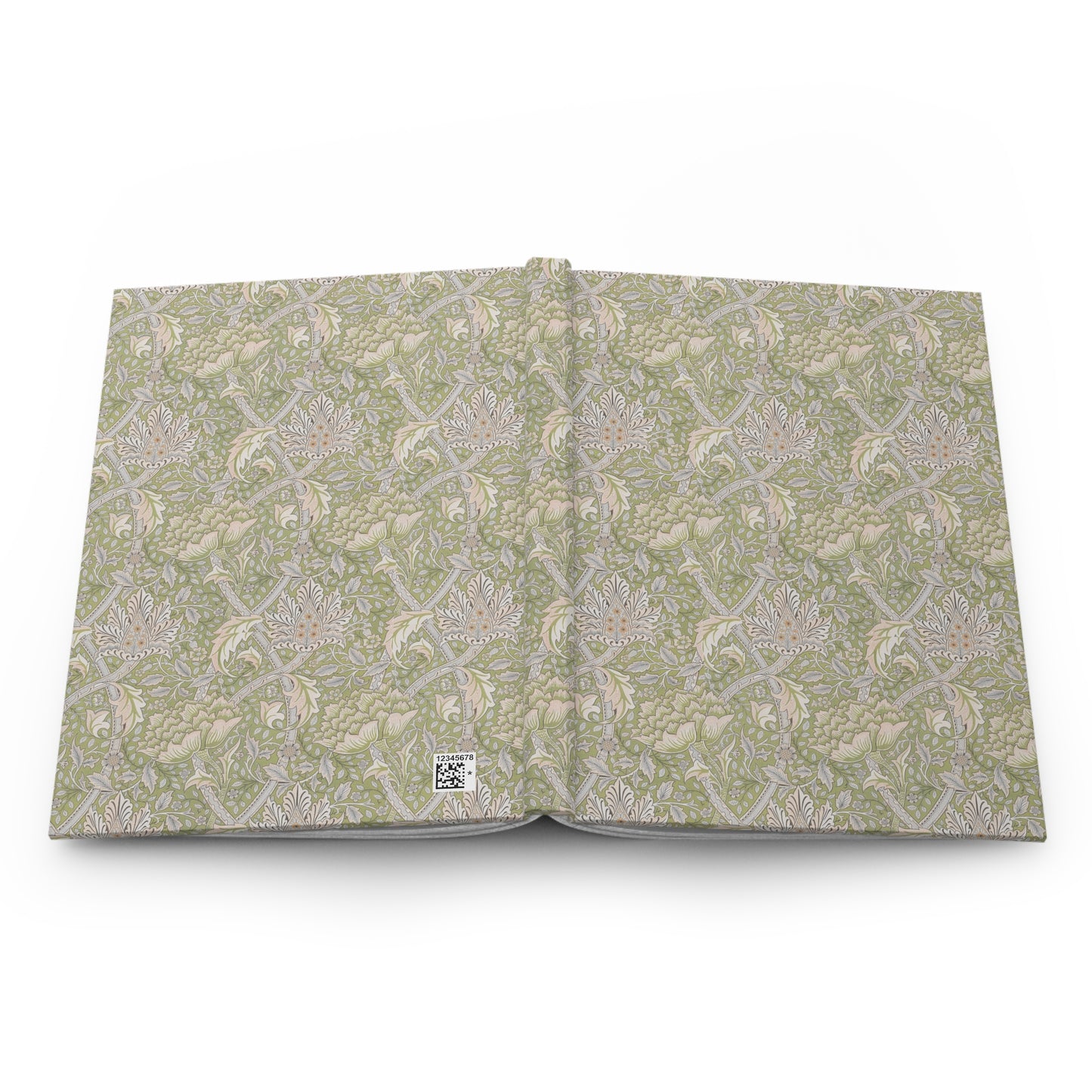 Open book with a green William Morris & Co floral pattern on a white background