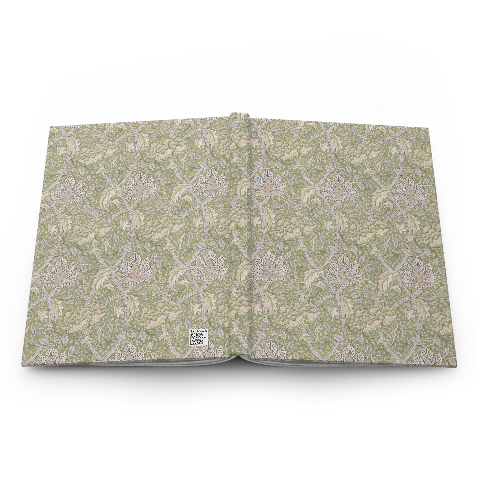 Open book with a green William Morris & Co floral pattern on a white background