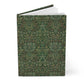 Notebook with green floral pattern on a white background