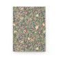 Notebook with a William Morris & Co decorative cover featuring birds and leaves on a pink background