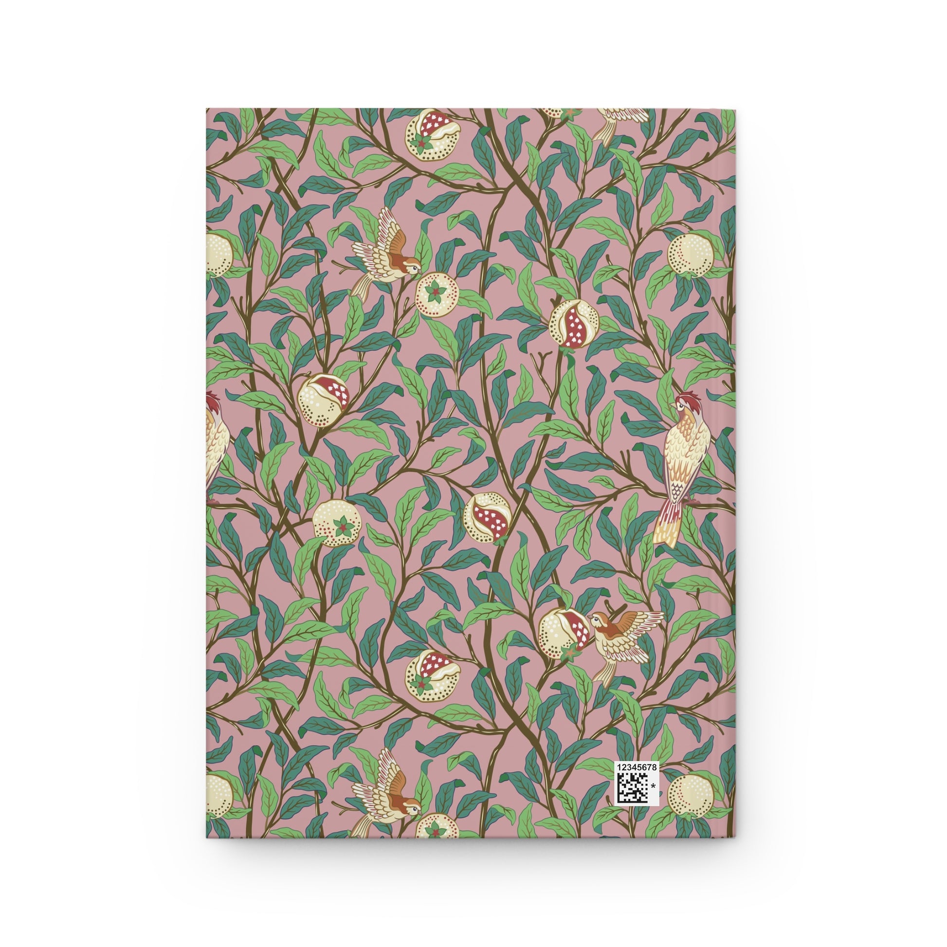 Notebook with a William Morris & Co decorative cover featuring birds and leaves on a pink background