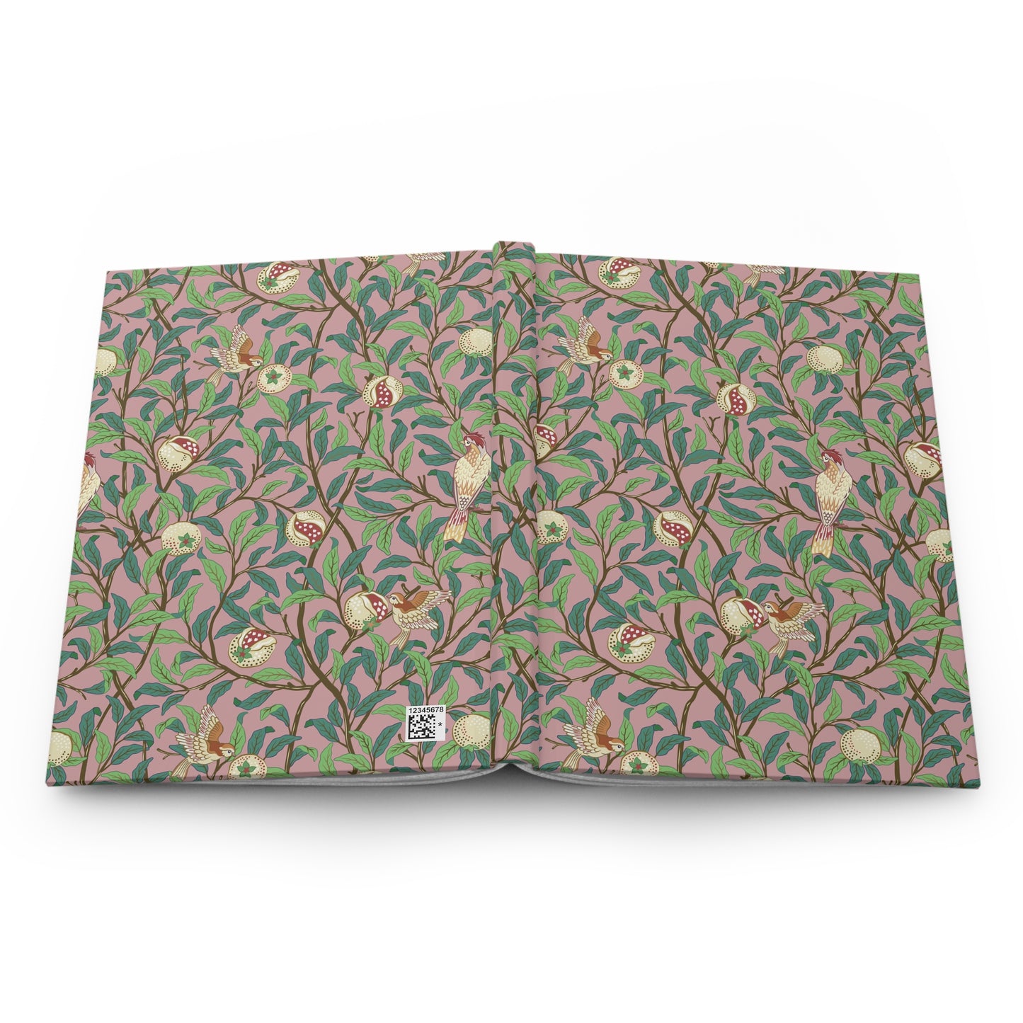 Patterned William Morris & Co notebook with green leaves and red berries on a pink background