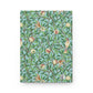 Notebook with a decorative cover featuring birds and branches on a blue background