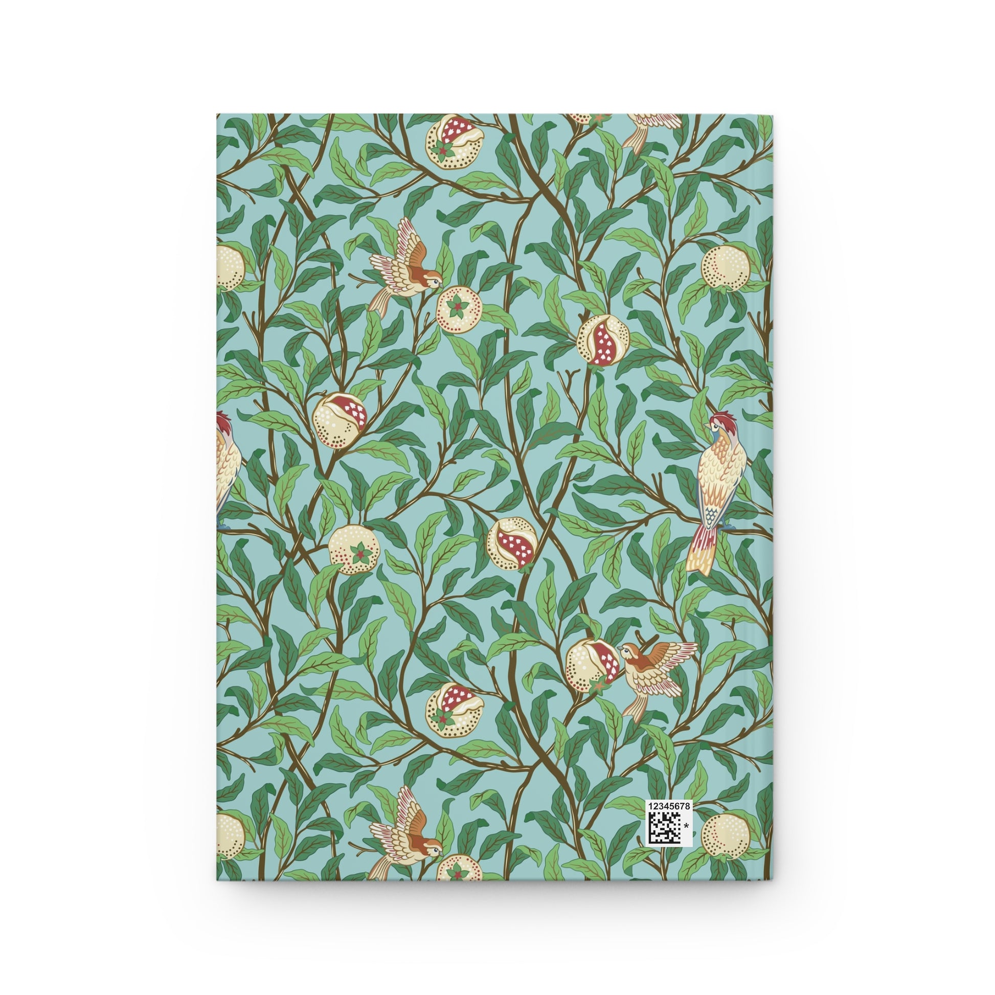 Notebook with a decorative cover featuring birds and branches on a blue background