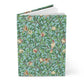 Notebook with a decorative cover featuring birds and branches on a blue background