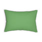 A green lumbar cushion with a floral William Morris & Co pattern, featuring a hidden beige zipper.