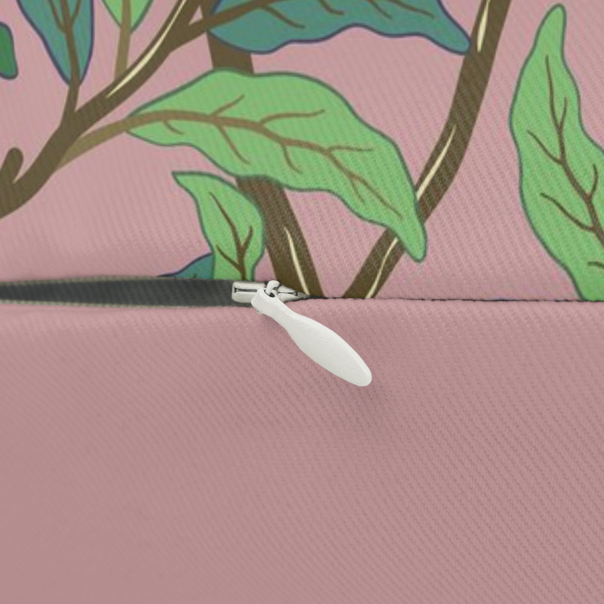 Rectangular lumbar cushion with a floral and bird design inspired by William Morris, in predominantly green and pink colours.