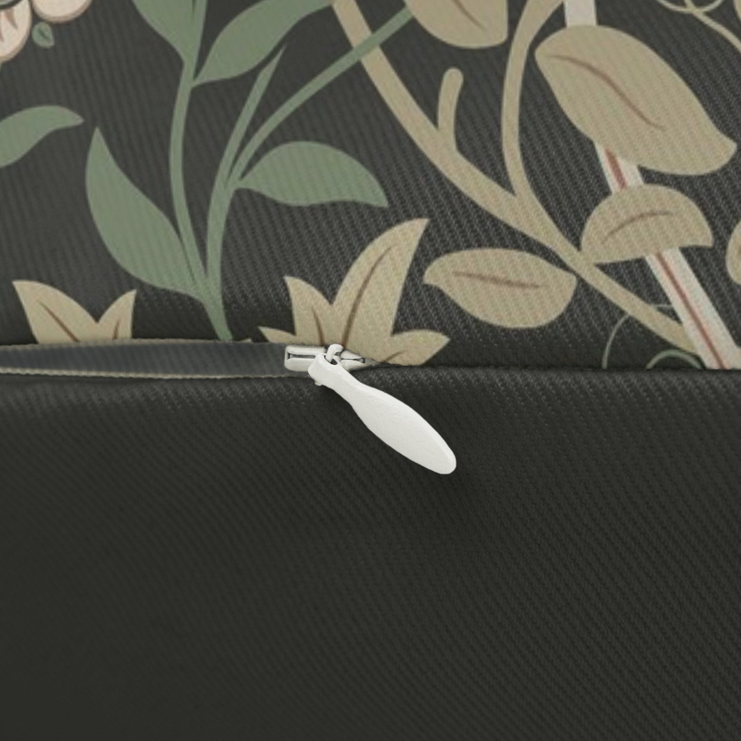 A rectangular William Morris inspired lumbar cushion with a floral pattern in beige, green, and red hues.