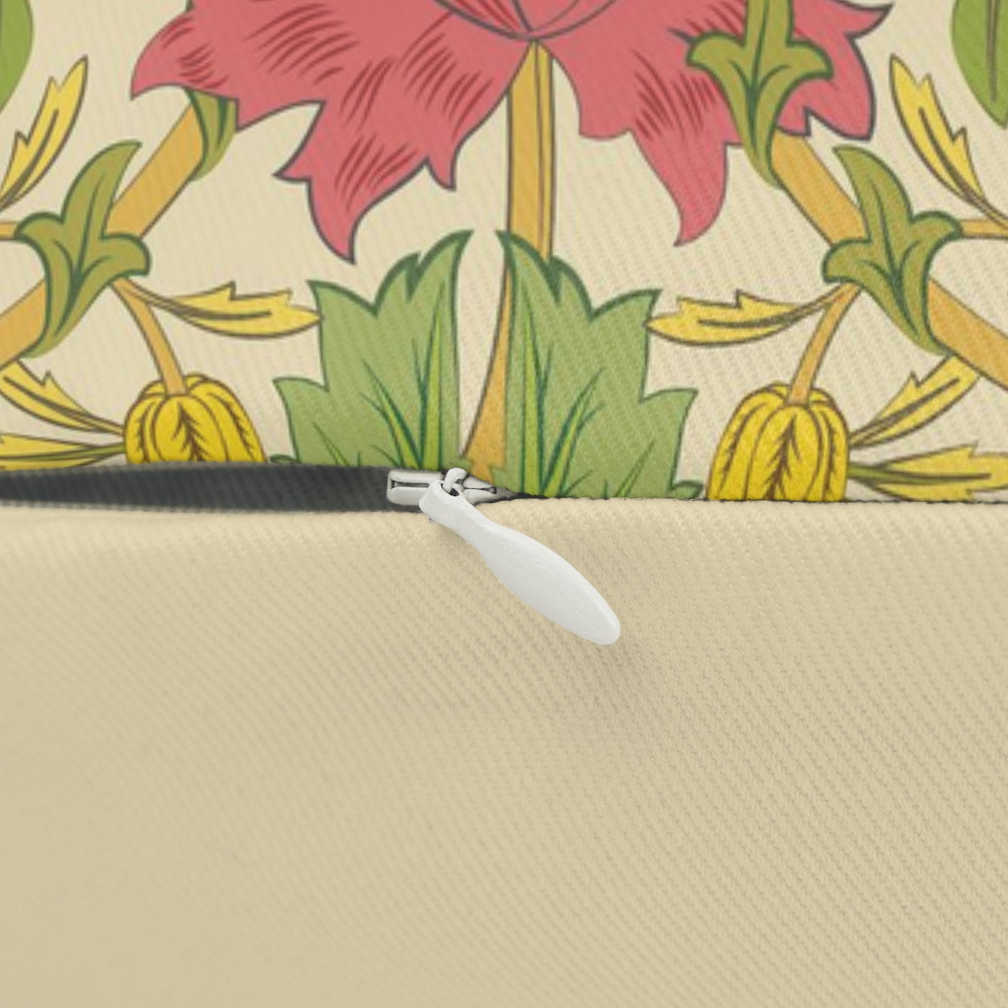 A rectangular lumbar cushion with a floral William Morris & Co pattern featuring honeysuckle designs in shades of pink, green, and yellow, and a concealed beige zipper.