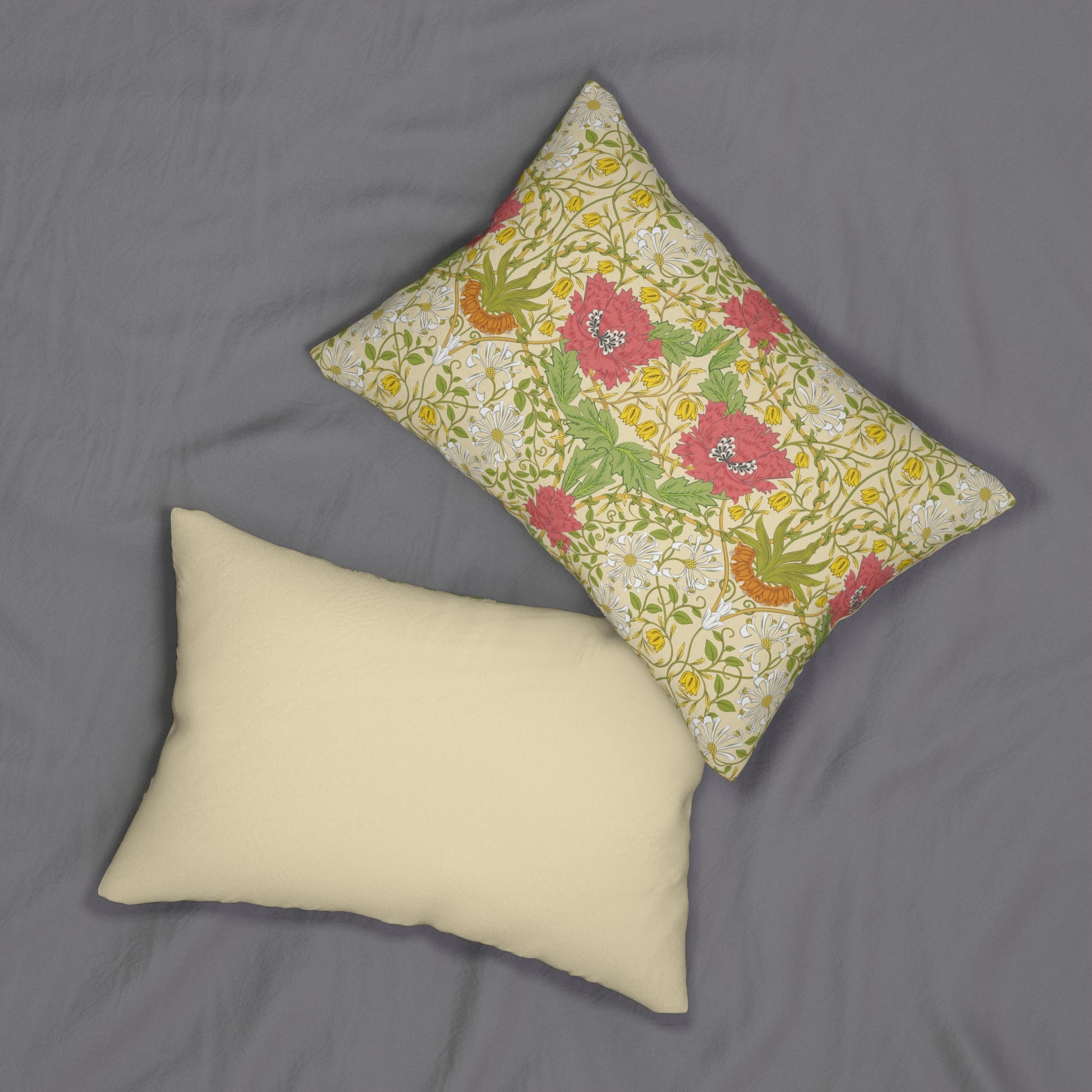 A rectangular lumbar cushion with a floral William Morris & Co pattern featuring honeysuckle designs in shades of pink, green, and yellow, and a concealed beige zipper.