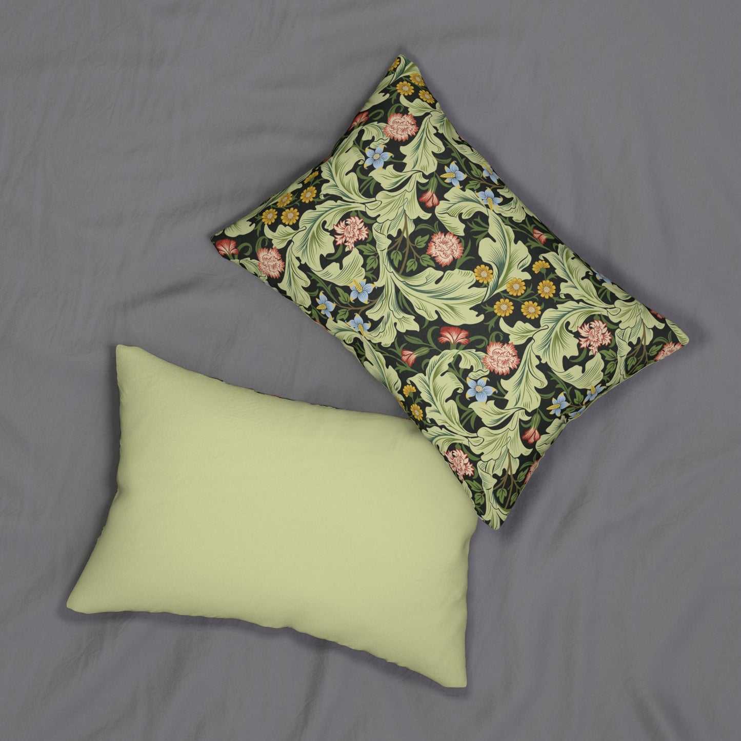 A rectangular lumbar cushion with a green William Morris & Co floral pattern on a mildew-resistant spun polyester fabric, featuring a concealed beige zipper.