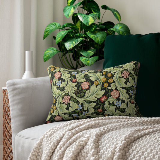A rectangular lumbar cushion with a green William Morris & Co floral pattern on a mildew-resistant spun polyester fabric, featuring a concealed beige zipper.