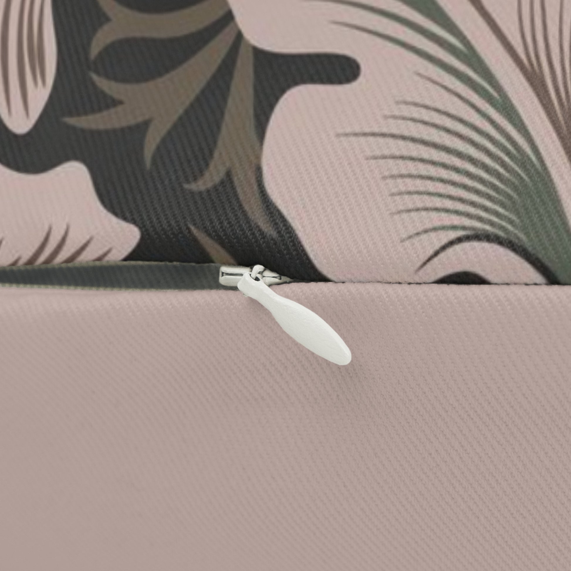 A rectangular lumbar cushion with a floral William Morris & Co pattern in muted colours on a dark background, featuring a concealed zipper.