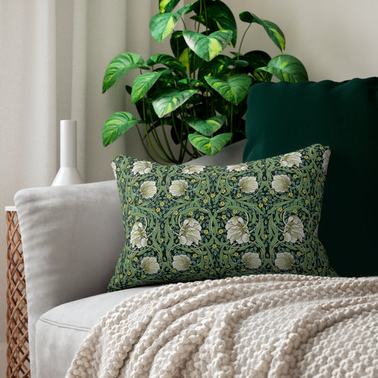 A rectangular lumbar cushion with a green William Morris & Co floral pattern on a green background, featuring a concealed beige zipper.