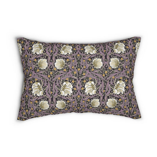 A rectangular lumbar cushion with a William Morris & Co floral pattern featuring pink and yellow flowers and green leaves on a dark background, with a concealed beige zipper.
