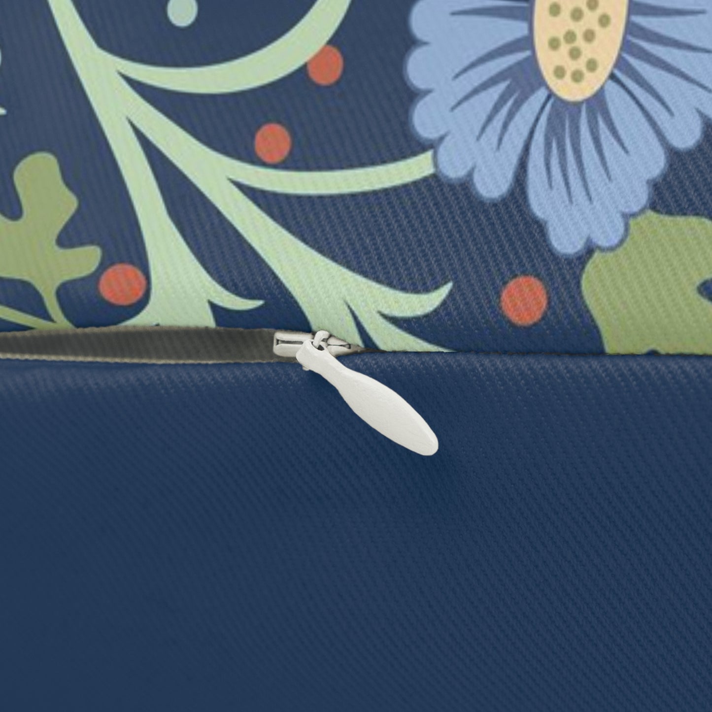 Rectangular lumbar cushion with a floral William Morris & Co pattern in blue, green, and yellow hues, featuring a hidden beige zipper.