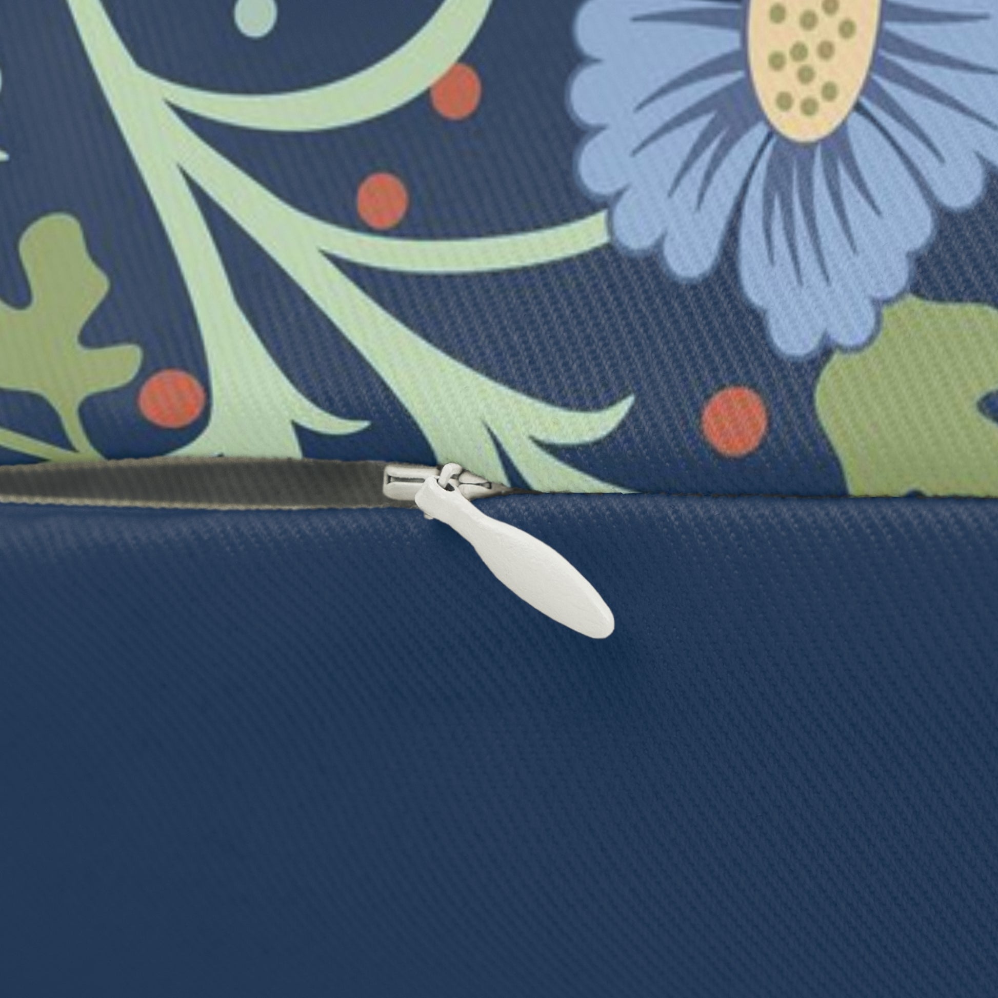 Rectangular lumbar cushion with a floral William Morris & Co pattern in blue, green, and yellow hues, featuring a hidden beige zipper.