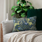 Rectangular lumbar cushion with a floral William Morris & Co pattern in blue, green, and yellow hues, featuring a hidden beige zipper.