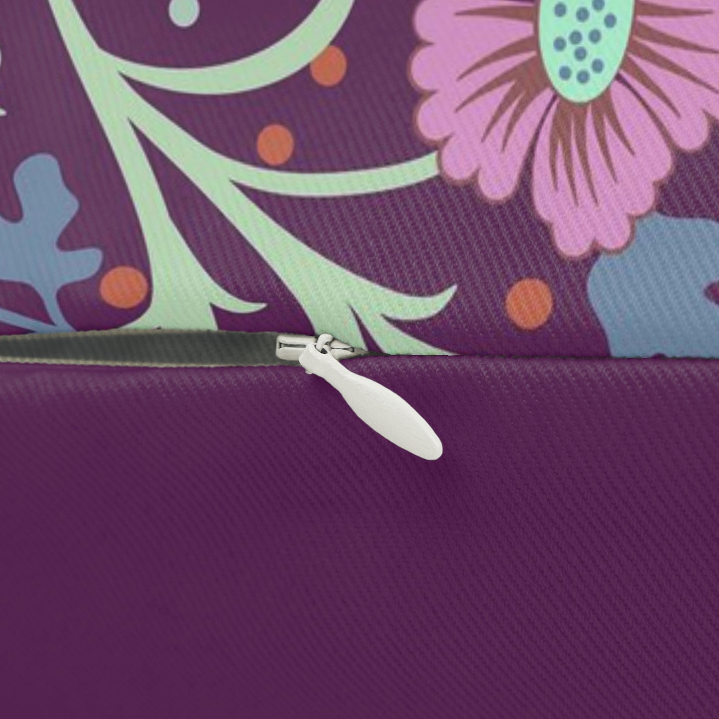 Rectangular lumbar cushion with a William Morris & Co floral pattern in pink, green, and purple colours