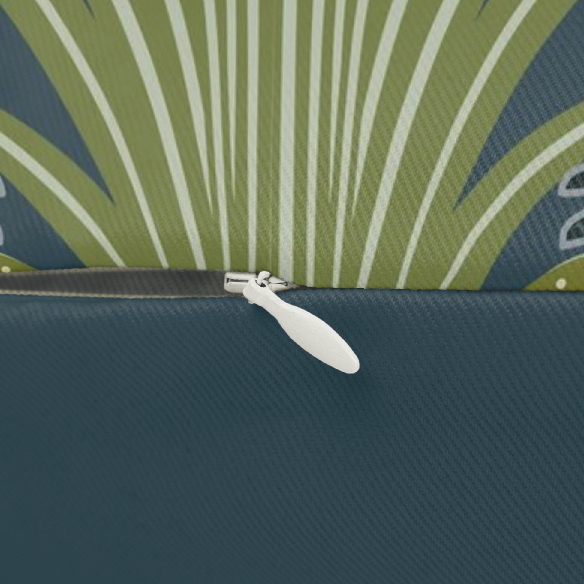 A decorative lumbar cushion featuring a white swan design on a darker background, with a floral William Morris & Co pattern in the background.