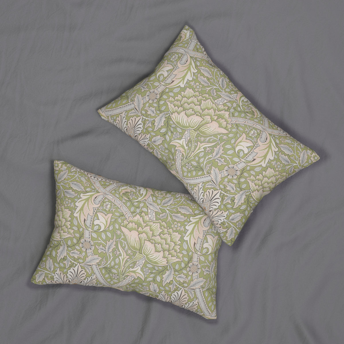 Two square decorative throw pillows with a green and cream floral damask pattern, displayed on a textured gray fabric background.