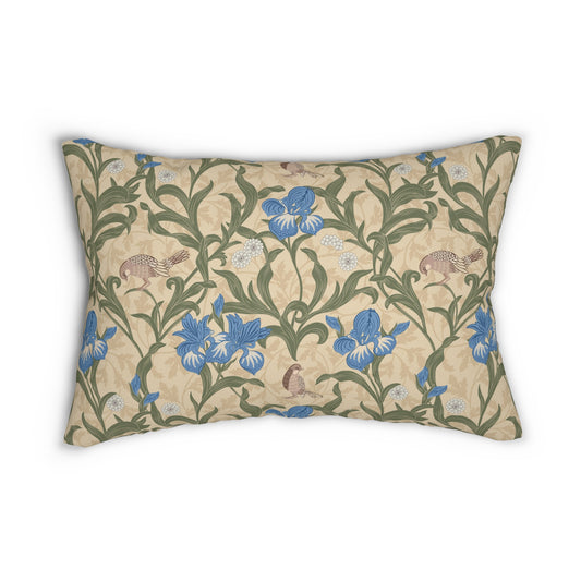 A rectangular lumbar cushion with a William Morris & Co floral pattern featuring blue irises, beige, and green colours on a white background with a concealed zipper.