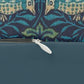 A rectangular lumbar cushion with a blue floral and animal pattern inspired by William Morris's art.