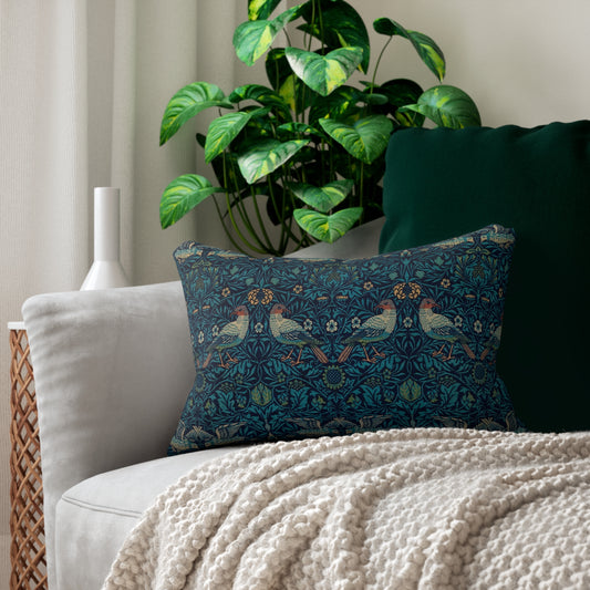 A rectangular lumbar cushion with a blue floral and animal pattern inspired by William Morris's art.