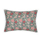 A rectangular decorative throw pillow featuring a classic William Morris-style floral pattern in pink, red, and cream on a muted blue-green background, shown against a plain white studio backdrop.