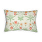A rectangular lumbar throw pillow featuring a botanical pattern with green leaves and orange, red, and white flowers on a textured cream background.