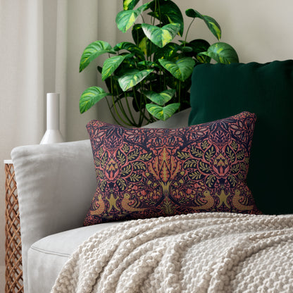 A rectangular decorative throw pillow featuring a dense, symmetrical Art Nouveau William Morris & Co pattern with stylised trees, leaves, and birds in coral pink, olive green and mustard yellow on a dark navy background.